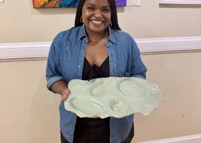 HUB Pottery Student with Charcuterie Board